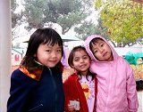 three students on the playground at Vacaville Child Care